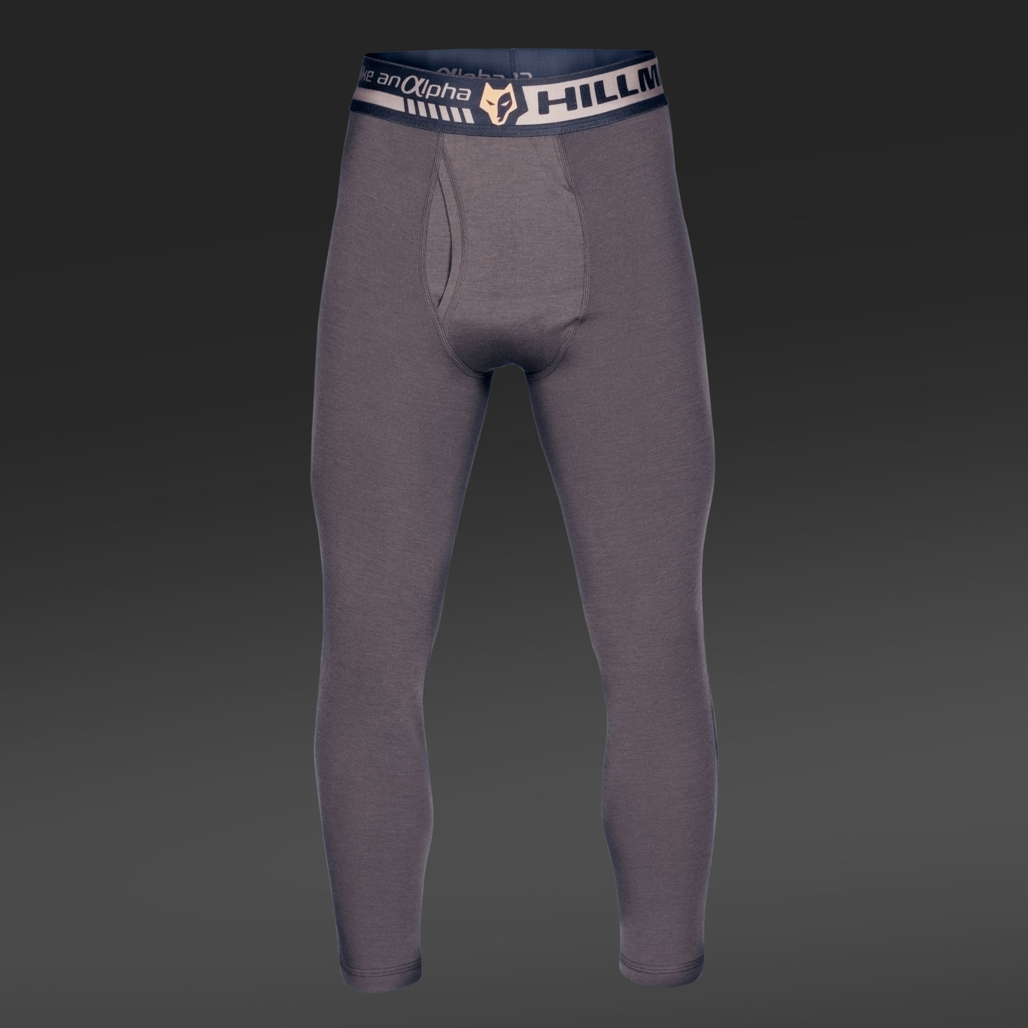 A pair of gray Hillman® Hunting Long Johns | Merino Wool Base Layer Bottom | 2BL, featuring a branded waistband, is shown against a dark gradient background.