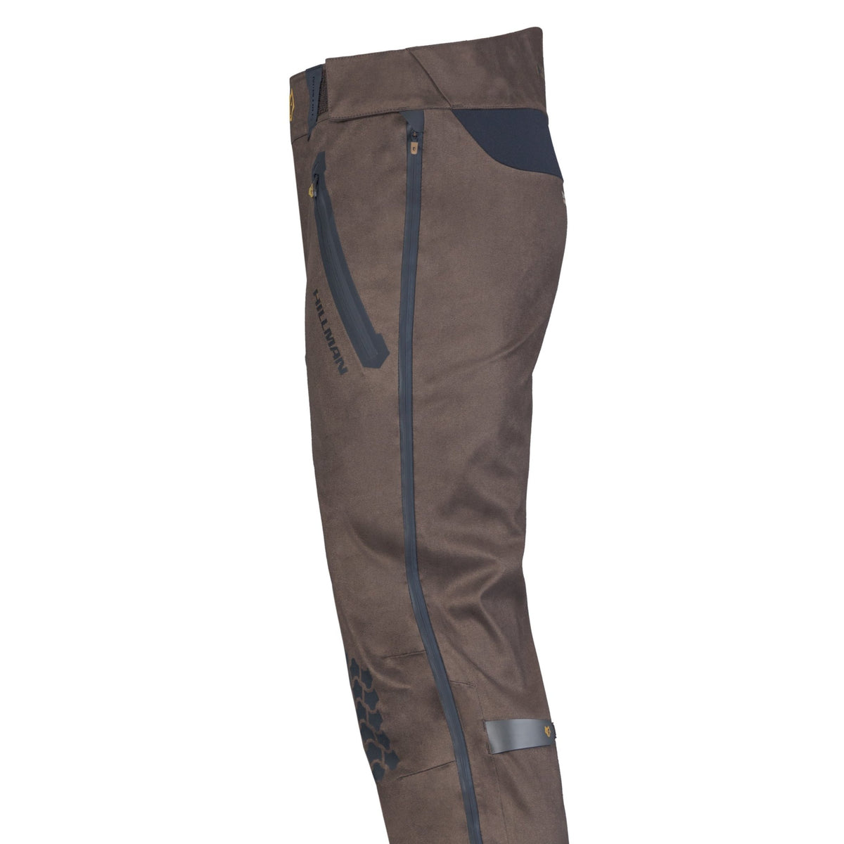 Side view of Hillman® Waterproof Hunting Pants | Lightweight AlphaShell 5WL in brown, featuring a black zippered pocket, dark hip patch, snap-button strap at the ankle, and hexagonal pattern on lower leg—ideal for lightweight hunting gear.