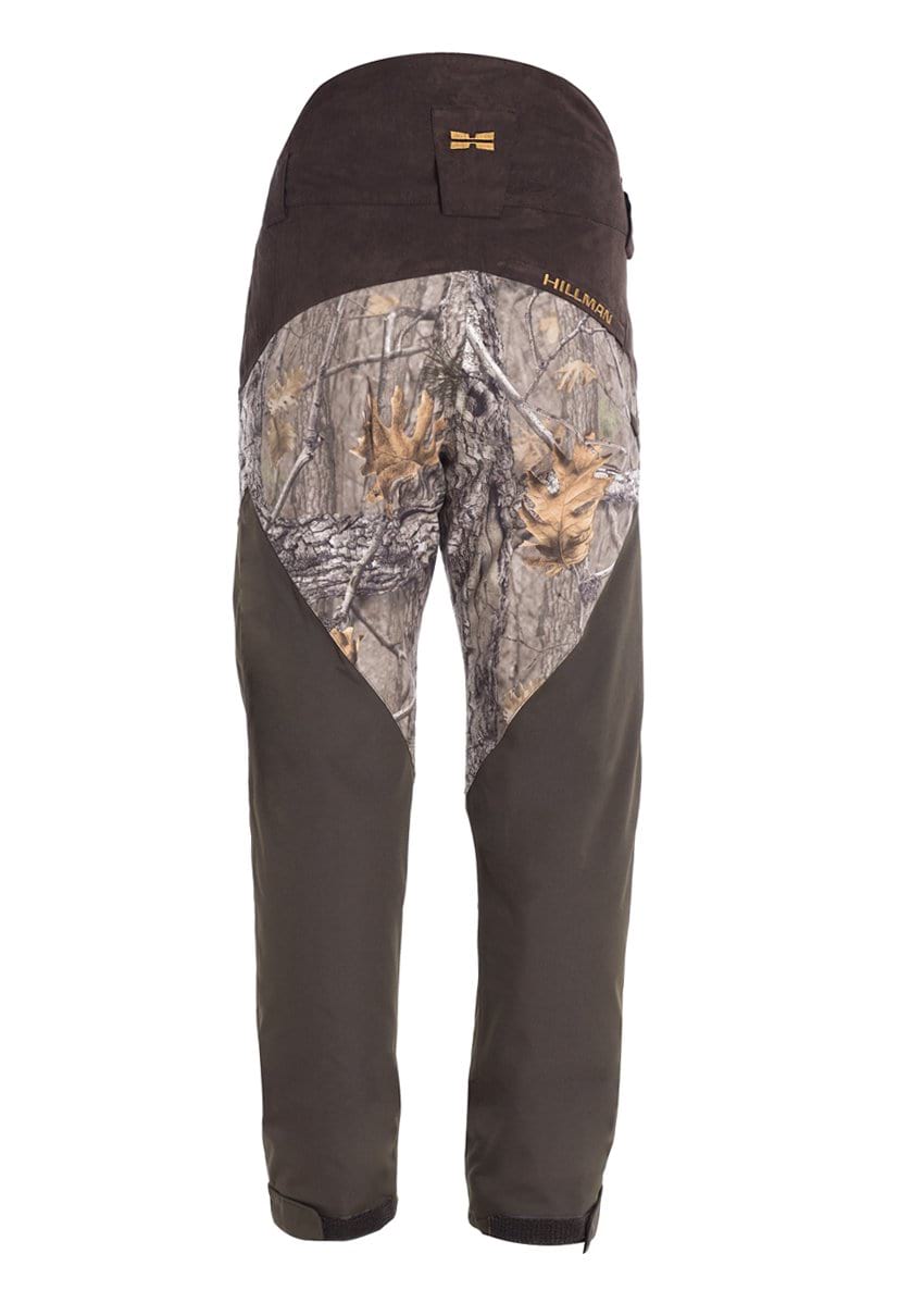 Hillman® Waterproof Insulated Camo Hunting Pants | Fusion feature a camo-patterned upper and dark olive lower legs, shown from the back with the Hillman® logo near the waistband.