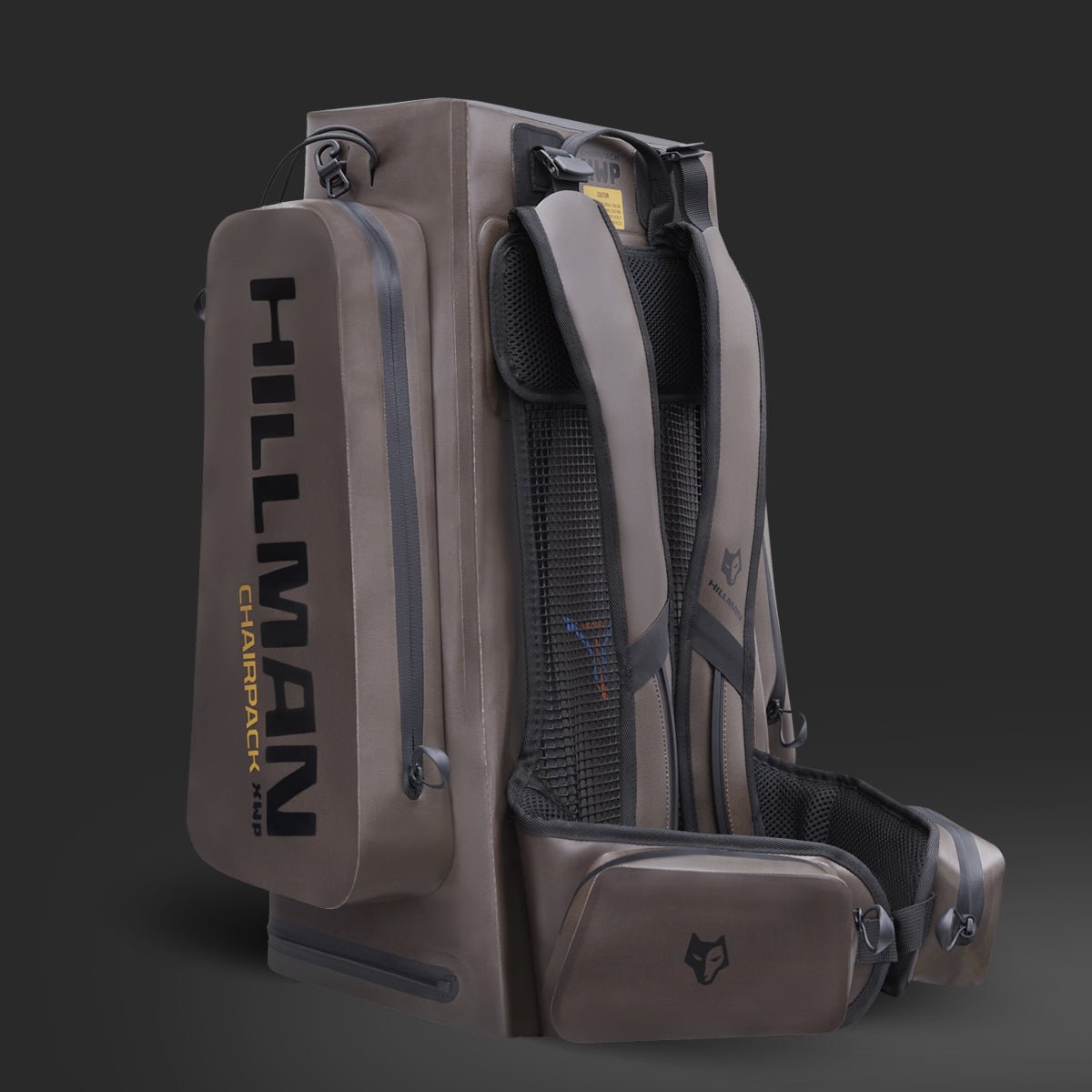 The Hillman® Chairpack XWP40 is a rugged dark gray waterproof hunting backpack with thick shoulder straps, waist belt, multiple compartments, side pocket, bold logo, and a built-in chair frame for outdoor convenience.