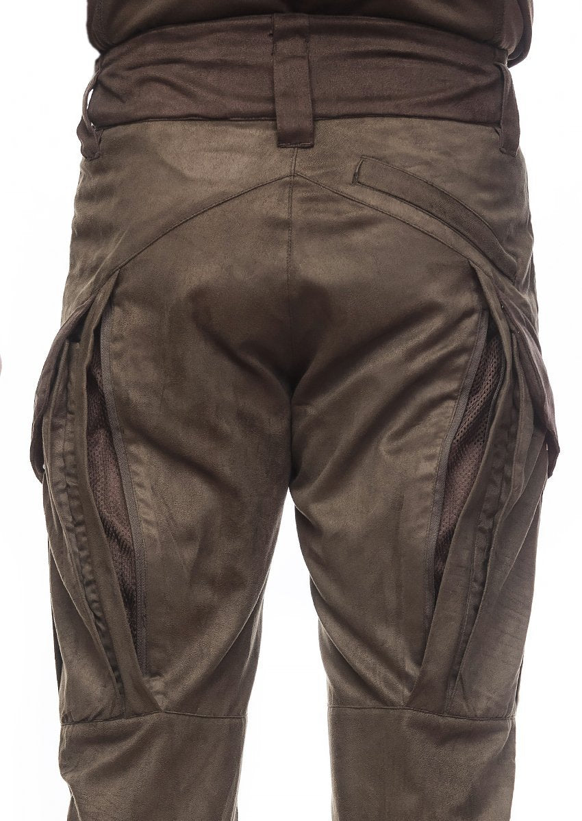 A close-up of the back of a person wearing Hillman® Upland Hunting Pants | Field - Lightweight XPR, featuring dark brown fabric, flap pockets, and mesh inserts for silent movement, showing only the lower torso and upper legs.
