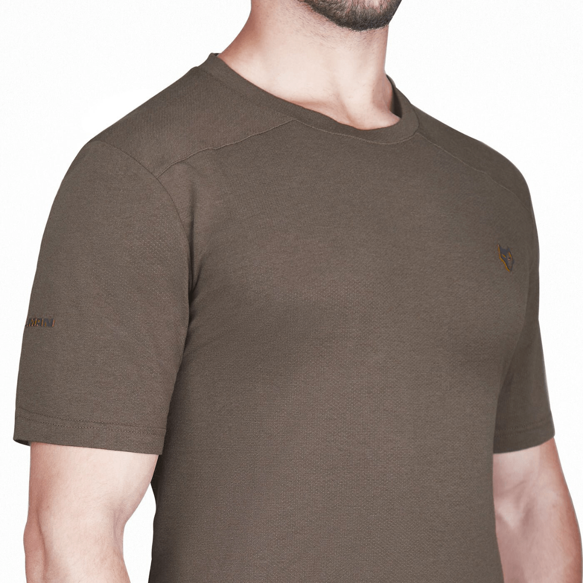 A man wearing a fitted Hillman® 1UL Bamboo Short Sleeve Hunting T-shirt with Active Vent Technology, featuring a small embroidered logo on the left chest and another on the sleeve. The image shows his upper torso.