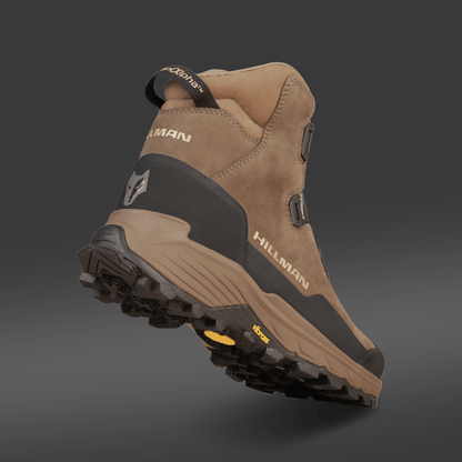 The Hillman® PRE-ORDER Waterproof Hunting Boots | DryHunt™, shown from a low rear angle, showcase their treaded sole and ankle support—ideal lightweight boots for comfort on long outdoor adventures.