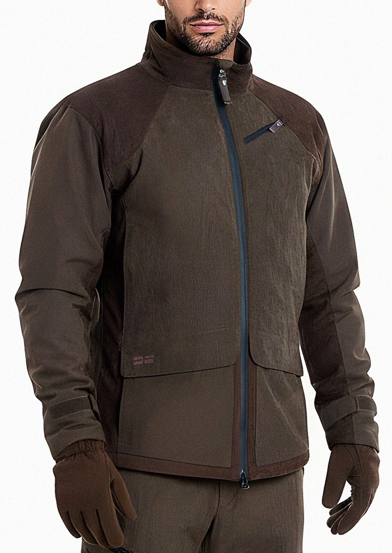 A man wears the Hillman® Waterproof Insulated Hunting Jacket | Fusion—brown with a high collar, vertical chest pocket, two large front pockets—paired with matching brown gloves and pants. His face is partially visible.