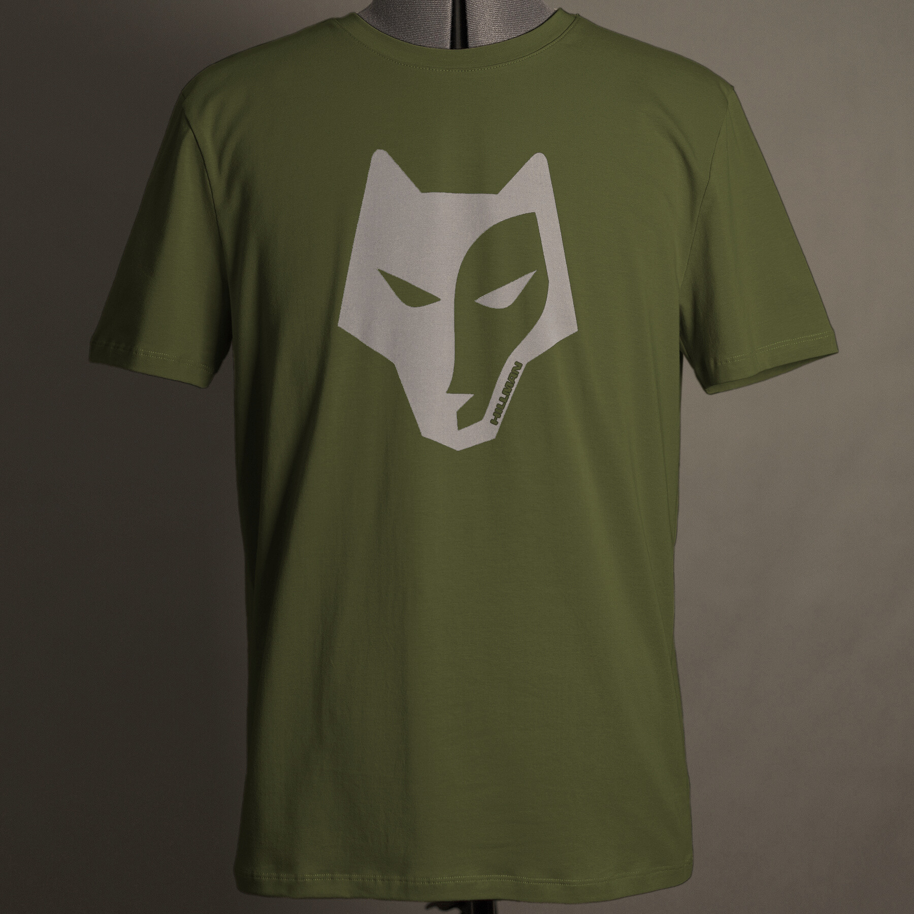 Displayed on a mannequin, the Hillman - България Alpha T-shirt in green features a white stylized wolf face graphic at its center. Crafted from luxurious Egyptian cotton, the neutral background perfectly highlights this design.