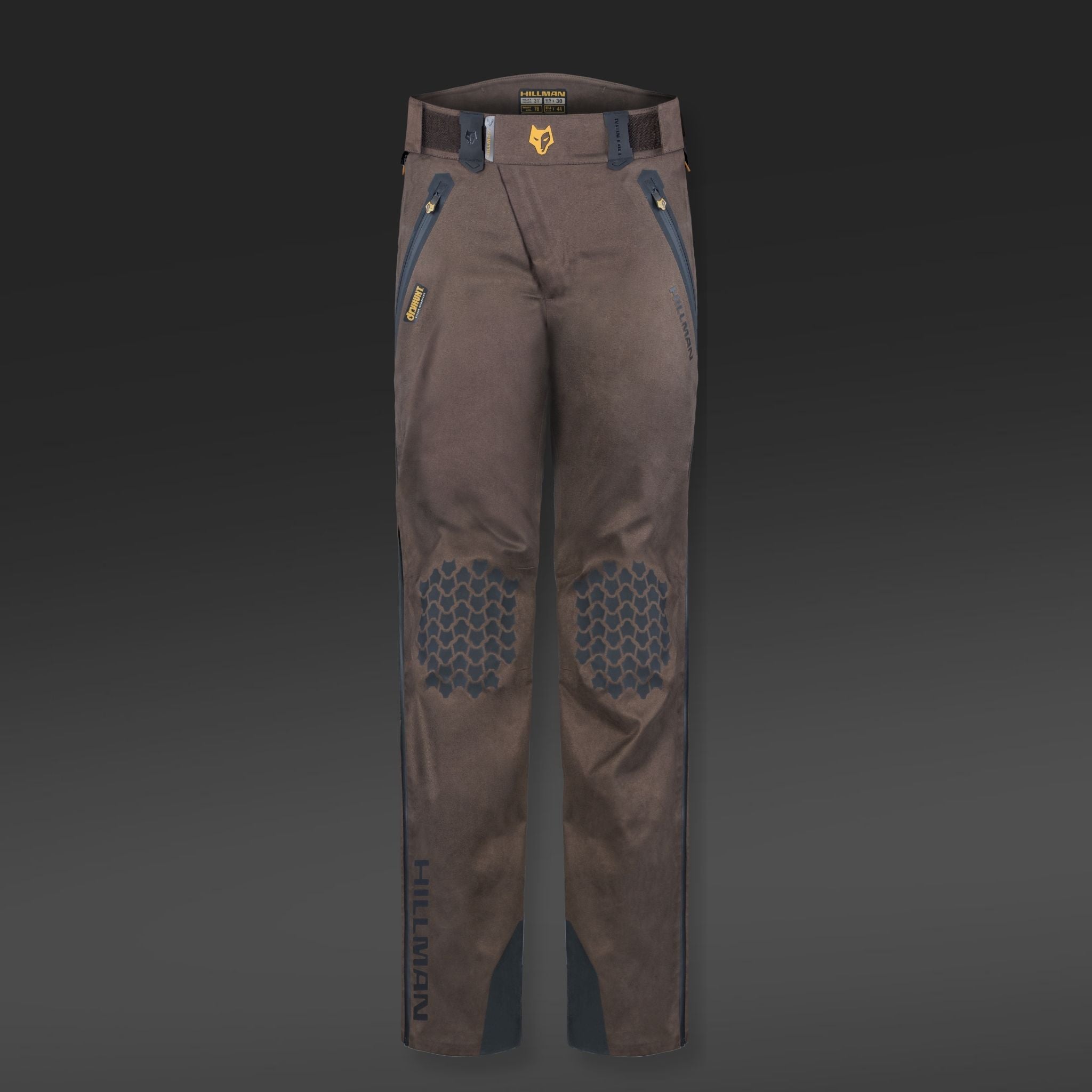 The 5WL Waterproof Camo Hunting Pants by HILLMAN GEAR are ultra-lightweight dark brown trousers with blue side and belt loop accents, reinforced knee honeycomb patterns, branded HILLMAN on a gradient gray background.