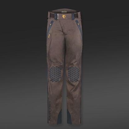 The 5WL Waterproof Camo Hunting Pants by HILLMAN GEAR are ultra-lightweight dark brown trousers with blue side and belt loop accents, reinforced knee honeycomb patterns, branded HILLMAN on a gradient gray background.
