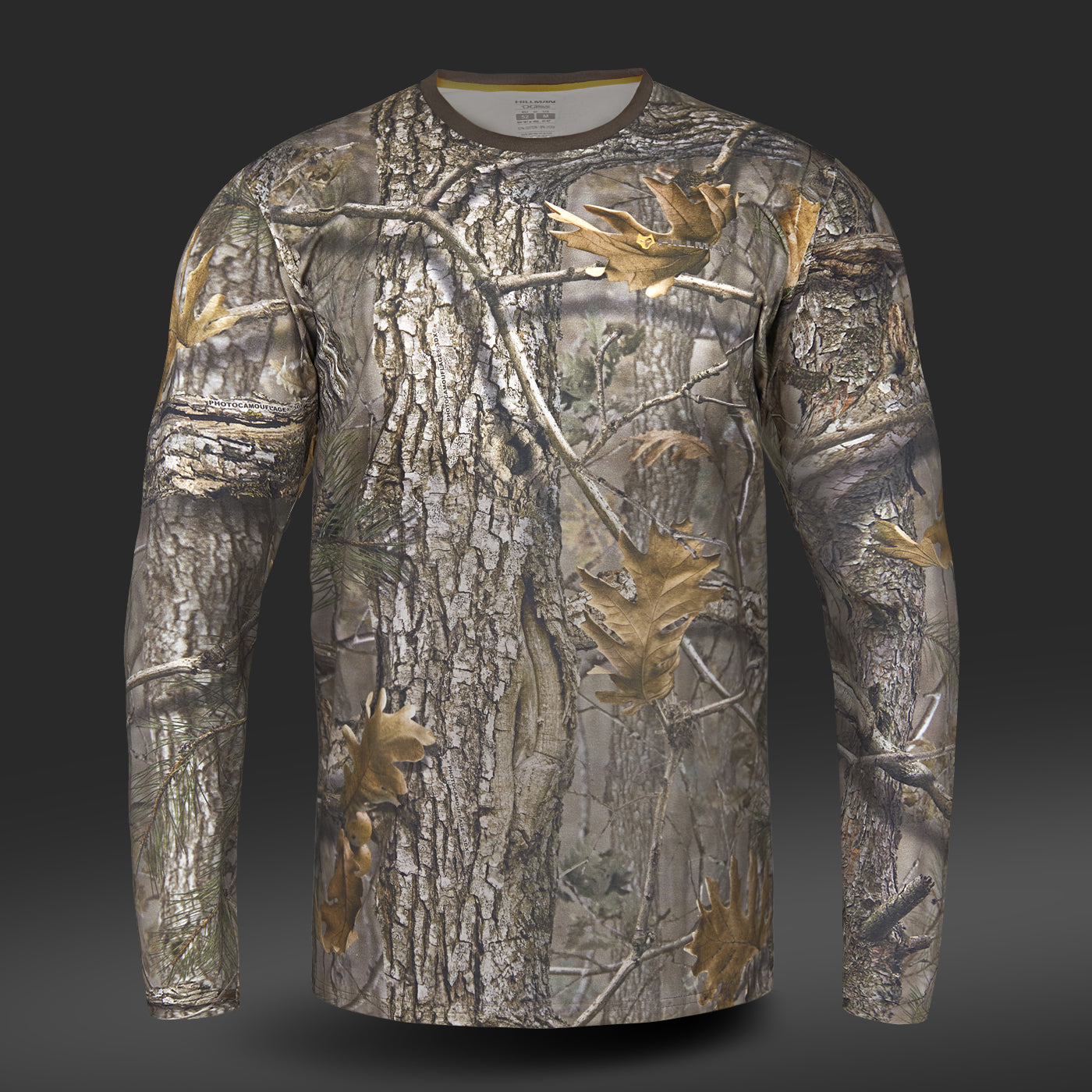 Experience the luxury of Hillman®s Hunting T-shirt DGT Cotton Long Sleeve, crafted from fine Egyptian cotton with a supersoft touch. Its realistic forest camouflage pattern—featuring brown tree bark, branches, and autumn leaves—is enhanced by cutting-edge digital print on dark gray.